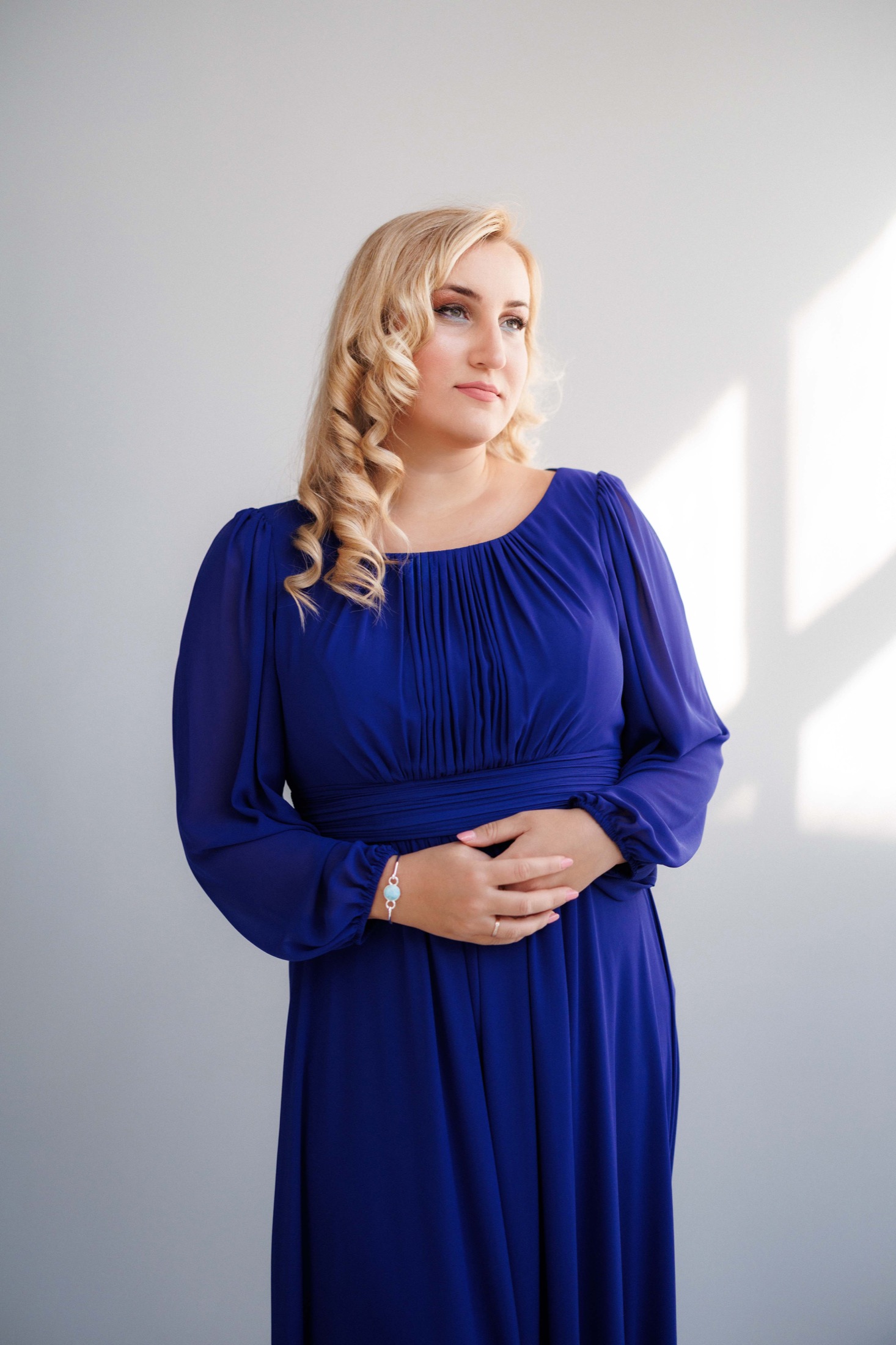 Portrait of Jovana Filipović Ćalić in a royal blue dress