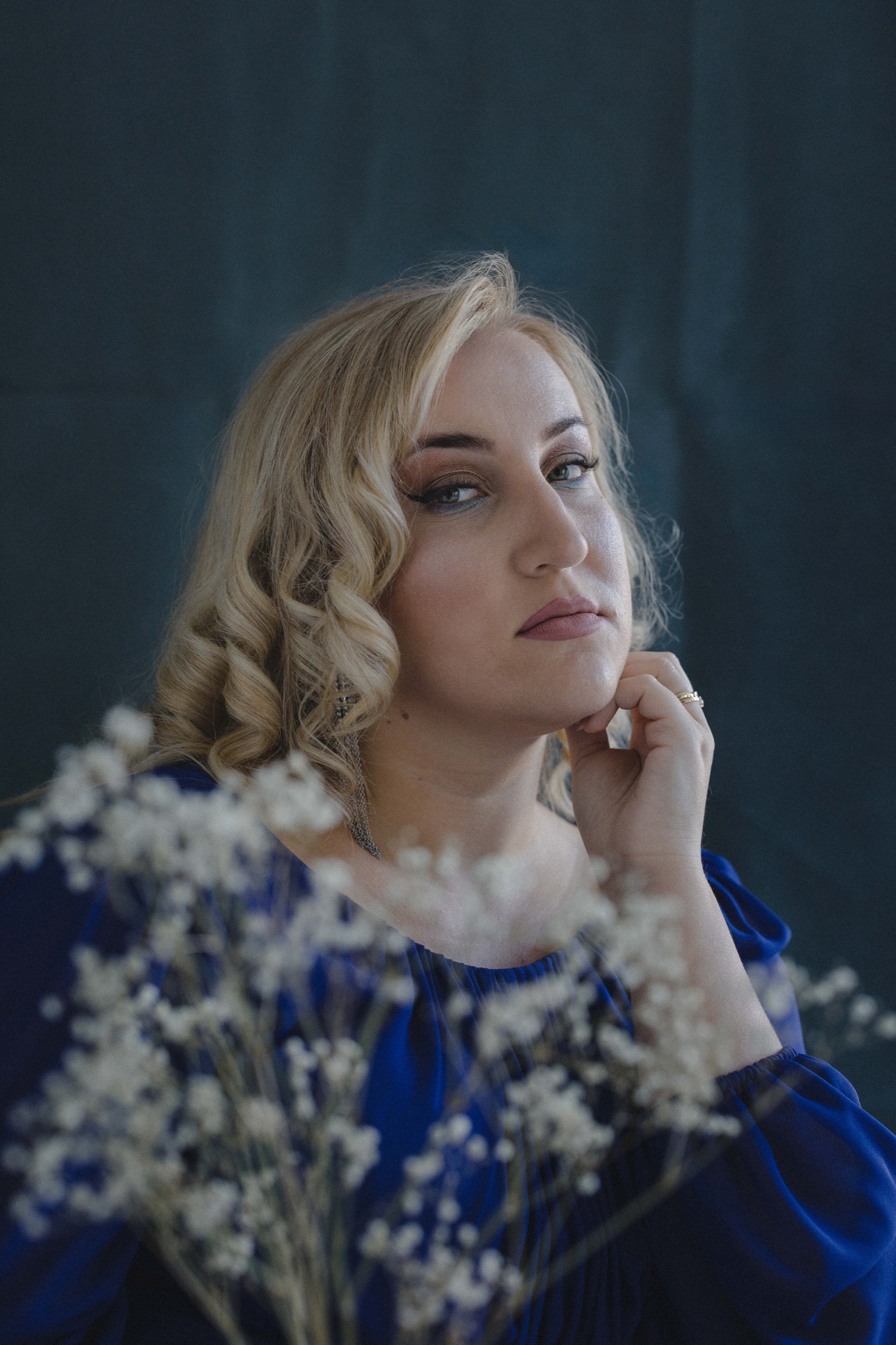 Close portrait of Jovana Filipović Ćalić with flowers in the foreground
